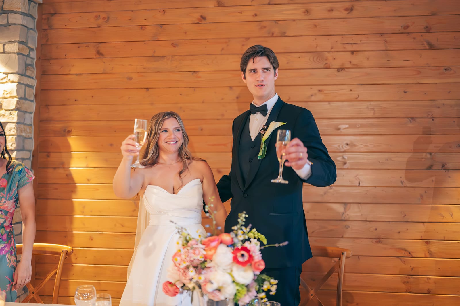 Carol and Eric raising champagne glasses in a toast